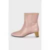 Leather ankle boots with gold heels