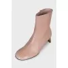 Leather ankle boots with gold heels