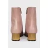 Leather ankle boots with gold heels