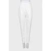 White denim suit with tag