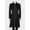 Fitted black coat with buttons