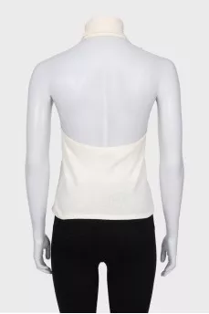 Beige top with an accent flower