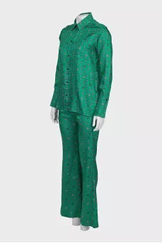 Suit with a silk blouse with a tag