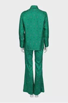 Suit with a silk blouse with a tag
