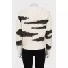 Knitted white sweater