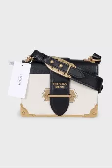 Leather and metal crossbody bag with tag