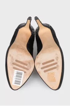 Black suede shoes decorated with rhinestones