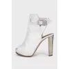 White leather sandals with metallic heels