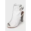 White leather sandals with metallic heels