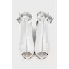 White leather sandals with metallic heels