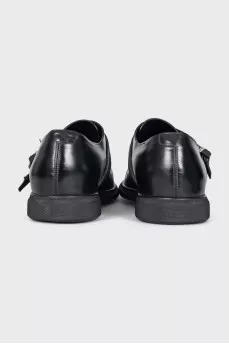 Men's leather shoes with decorative fastenings