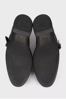 Men's leather shoes with decorative fastenings