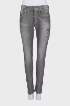Grey distressed skinny jeans