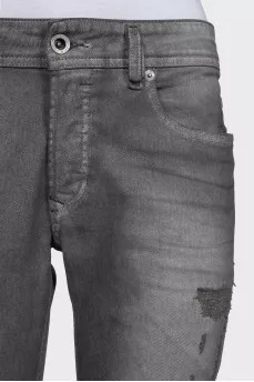 Grey distressed skinny jeans