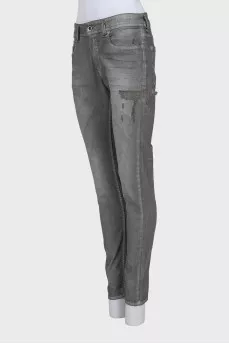 Grey distressed skinny jeans