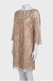 A straight-cut dress decorated with sequins