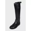 Black leather boots with straps