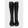 Black leather boots with straps