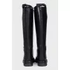 Black leather boots with straps
