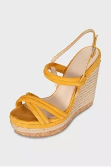 Suede sandals with a woven wedge heel