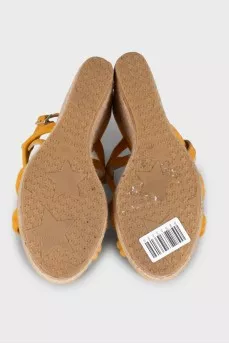 Suede sandals with a woven wedge heel