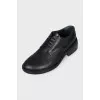Black leather brogues