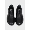 Black leather brogues