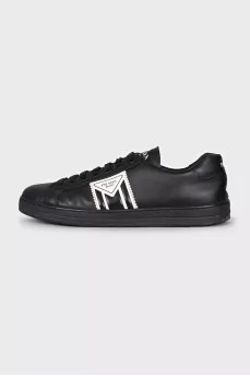 Men's black sneakers with a signature logo