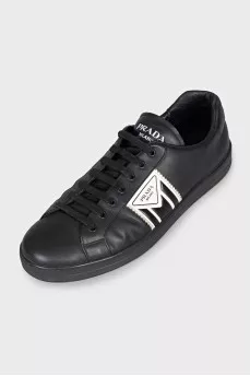 Men's black sneakers with a signature logo