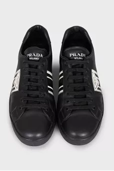 Men's black sneakers with a signature logo