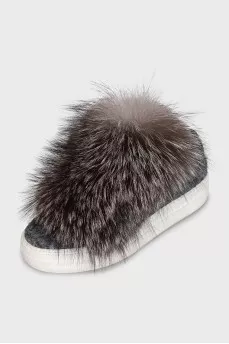 Textile sneakers decorated with fur