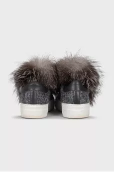 Textile sneakers decorated with fur