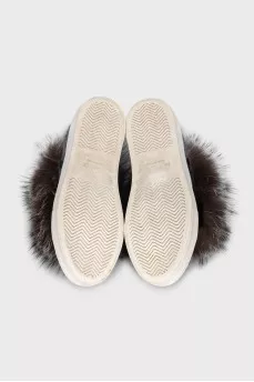 Textile sneakers decorated with fur