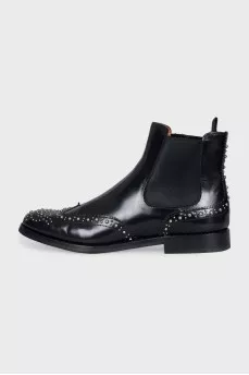 Black leather boots with metallic decor