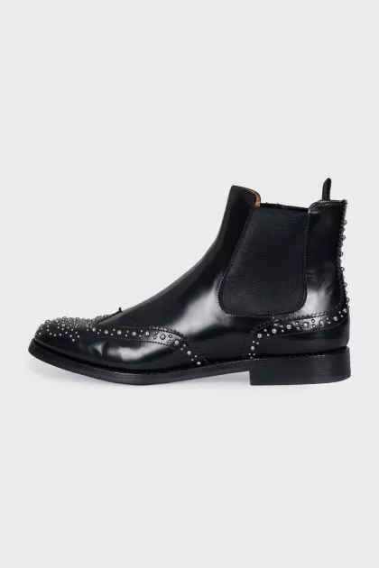Black leather boots with metallic decor