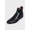Black leather boots with metallic decor
