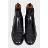 Black leather boots with metallic decor