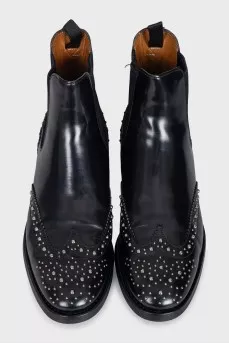 Black leather boots with metallic decor