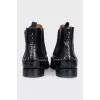 Black leather boots with metallic decor