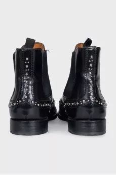 Black leather boots with metallic decor