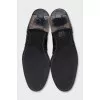 Black leather boots with metallic decor