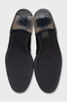 Black leather boots with metallic decor