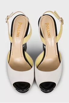 White sandals with striped heels