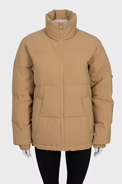 Beige jacket with a high collar