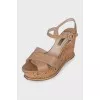 Beige patent leather wedge sandals