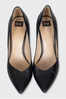 Black leather pumps