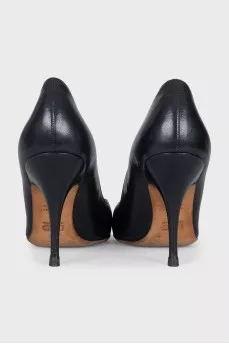 Black leather pumps