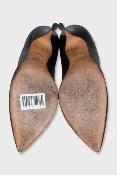 Black leather pumps