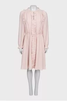 Fitted dress decorated with frills