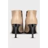 Leather ankle boots with pointed toe and zip closure